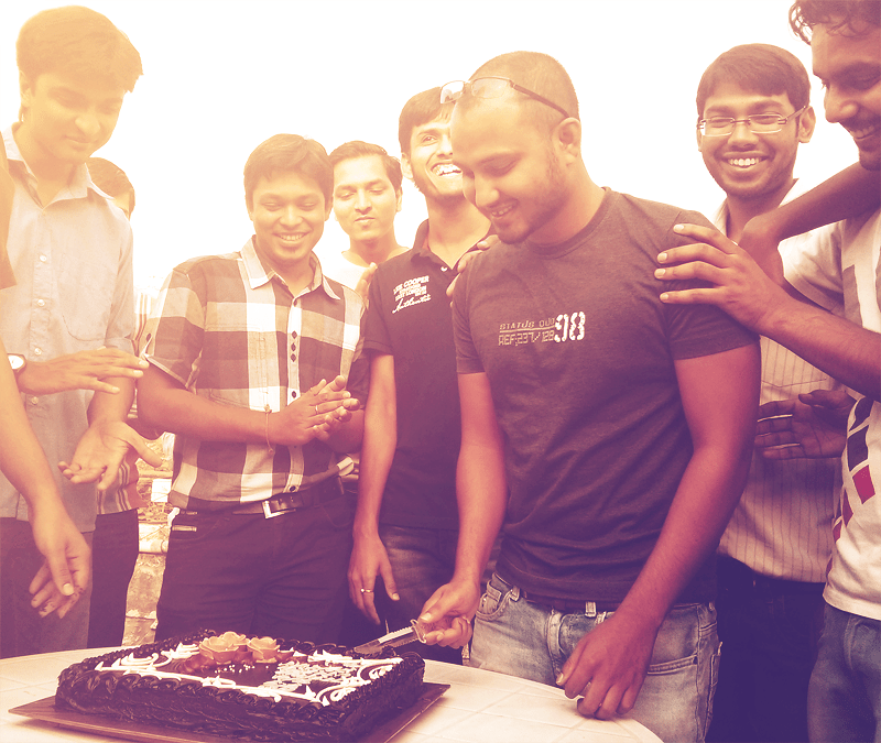 Happiness of contributing to the community - Joshua cutting the cake accompanied by Umesh, Chirag and Pranav. 
